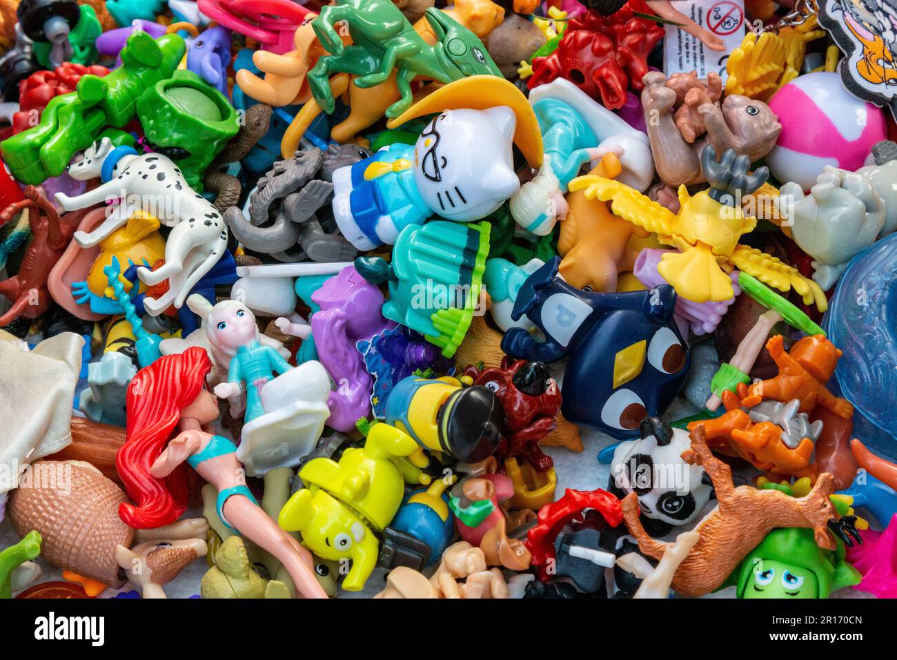 A colourful, jumble, pile of assorted small plastic toys. Stock Photo