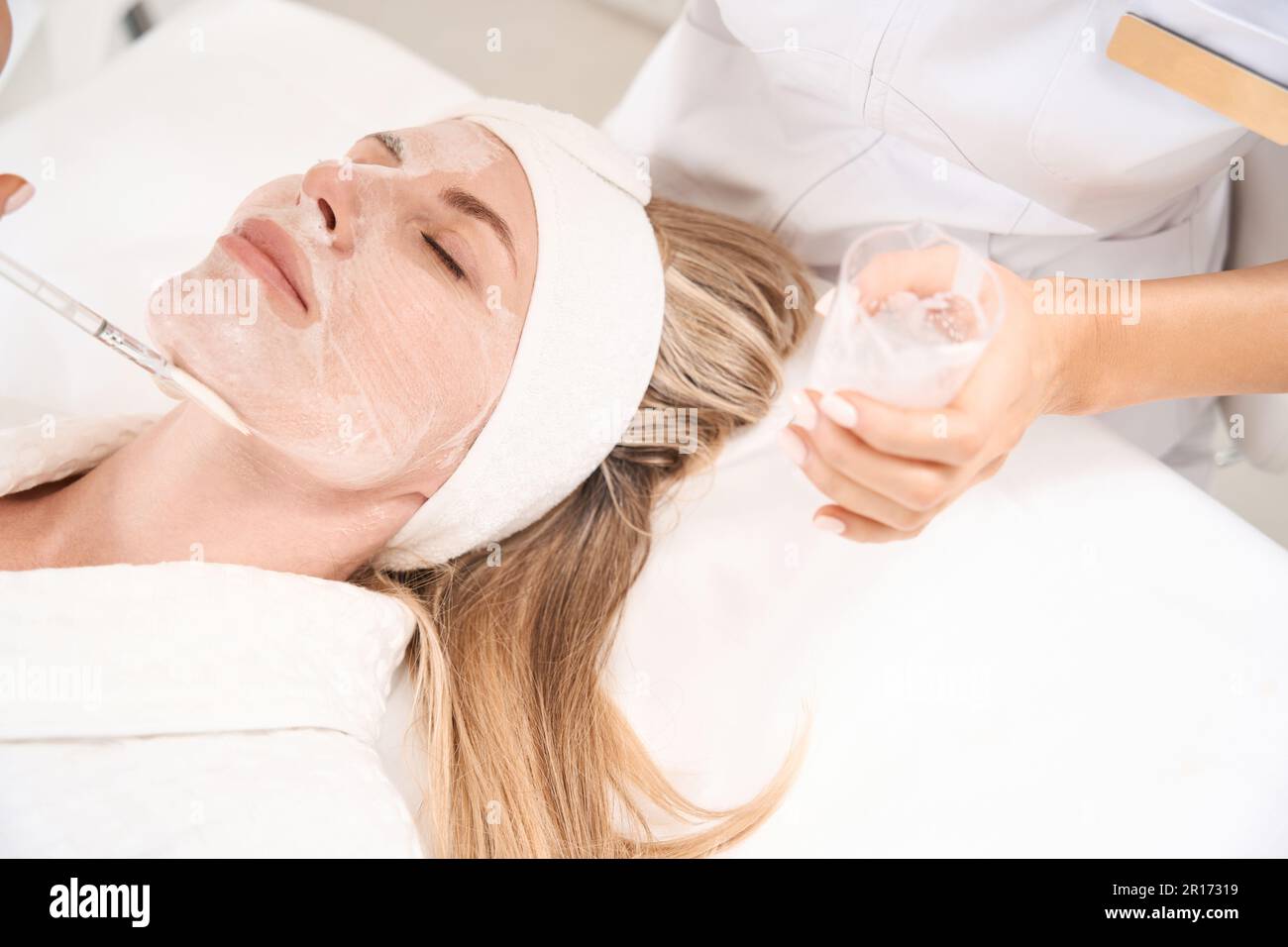 Young woman applies body scrub hi-res stock photography and images - Alamy