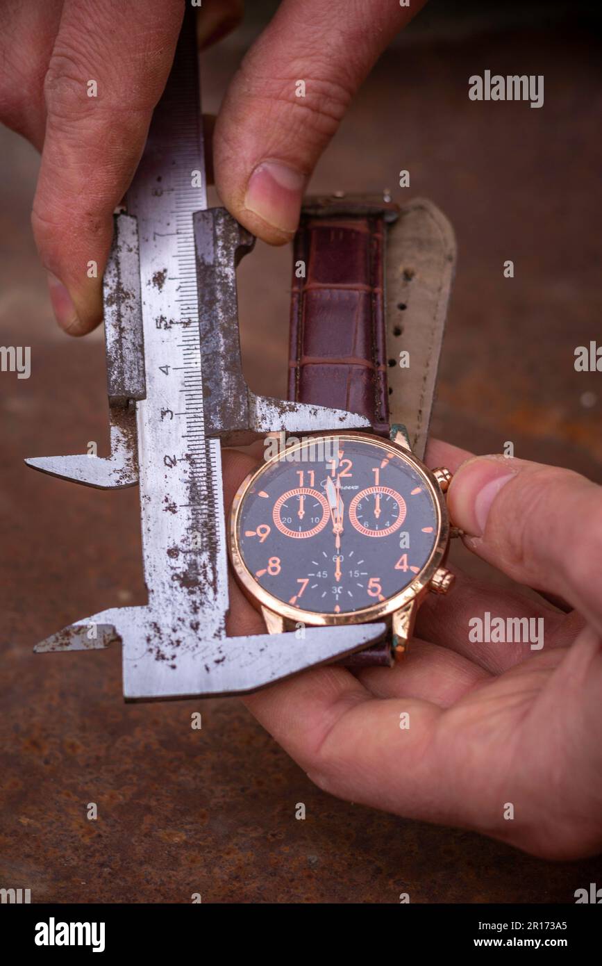 time measurement concept moving, watch is ticking metal shtangel bar