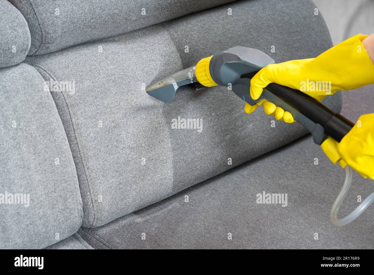 Sofa before and after wet cleaning indoors. textile sofa vacuum