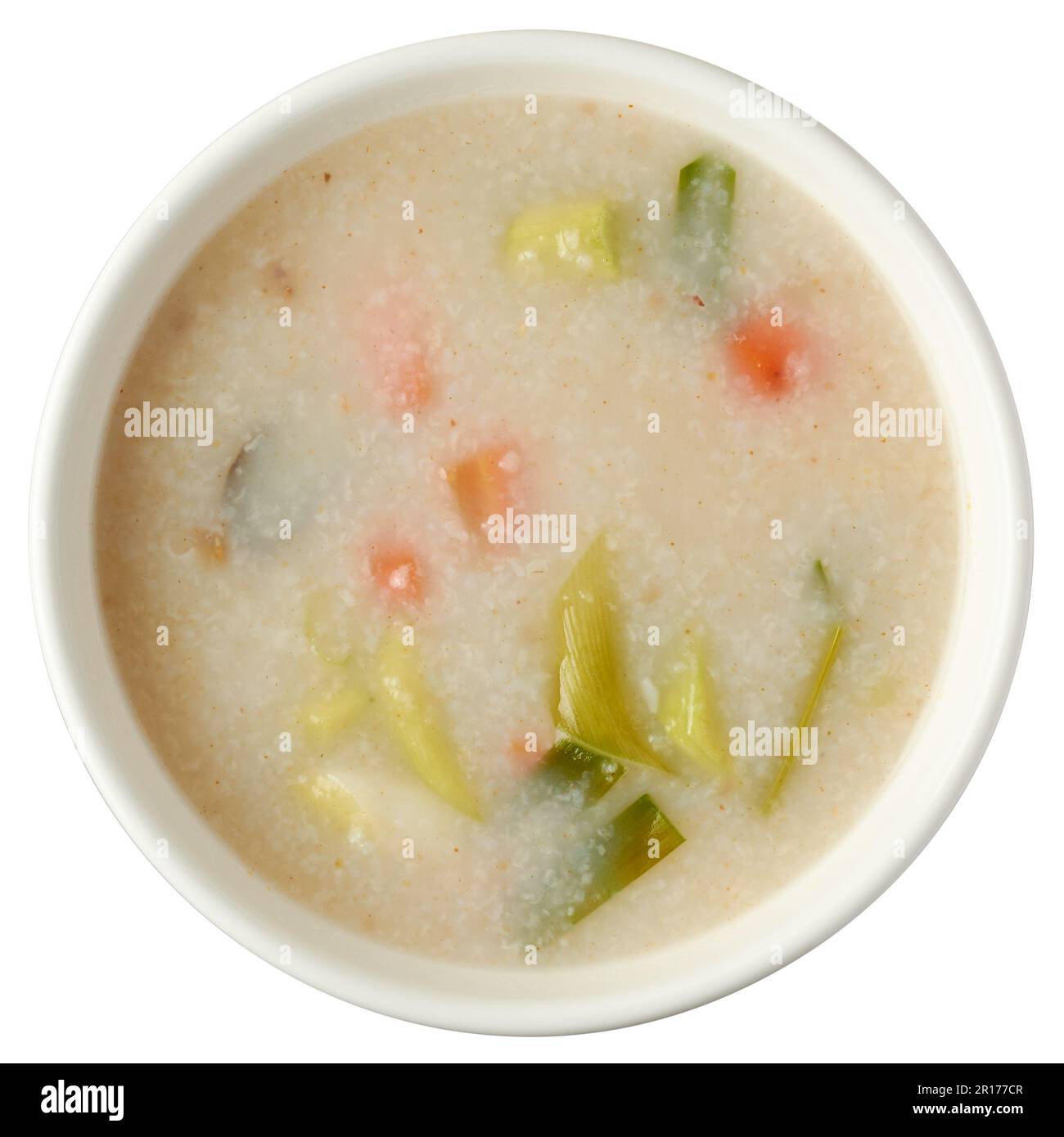 bowl of rice porridge or rice gruel with vegetables, aka rice kanji or congee, comfort and easy to digest creamy textured breakfast food isolated Stock Photo