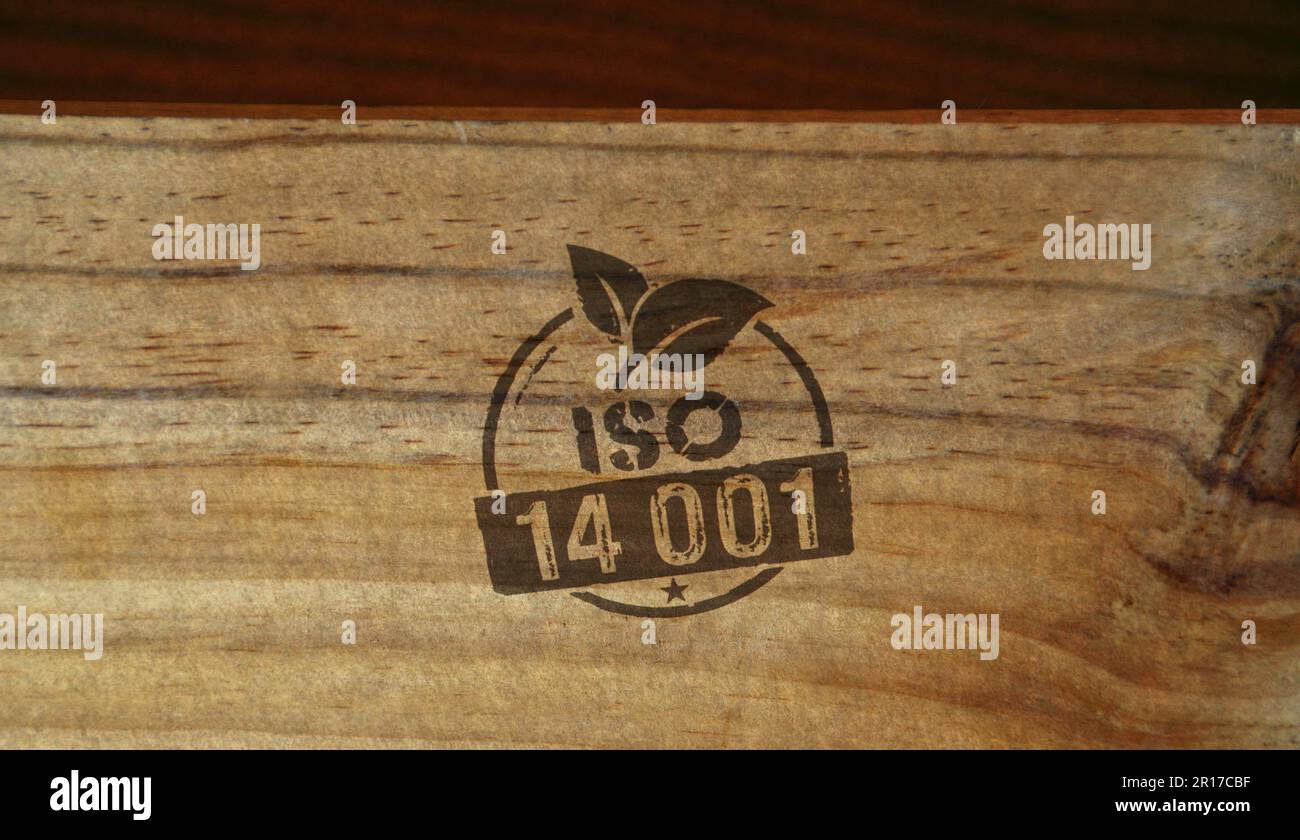 ISO 14001 certified stamp printed on wooden box. Environment ecology standard certificate
