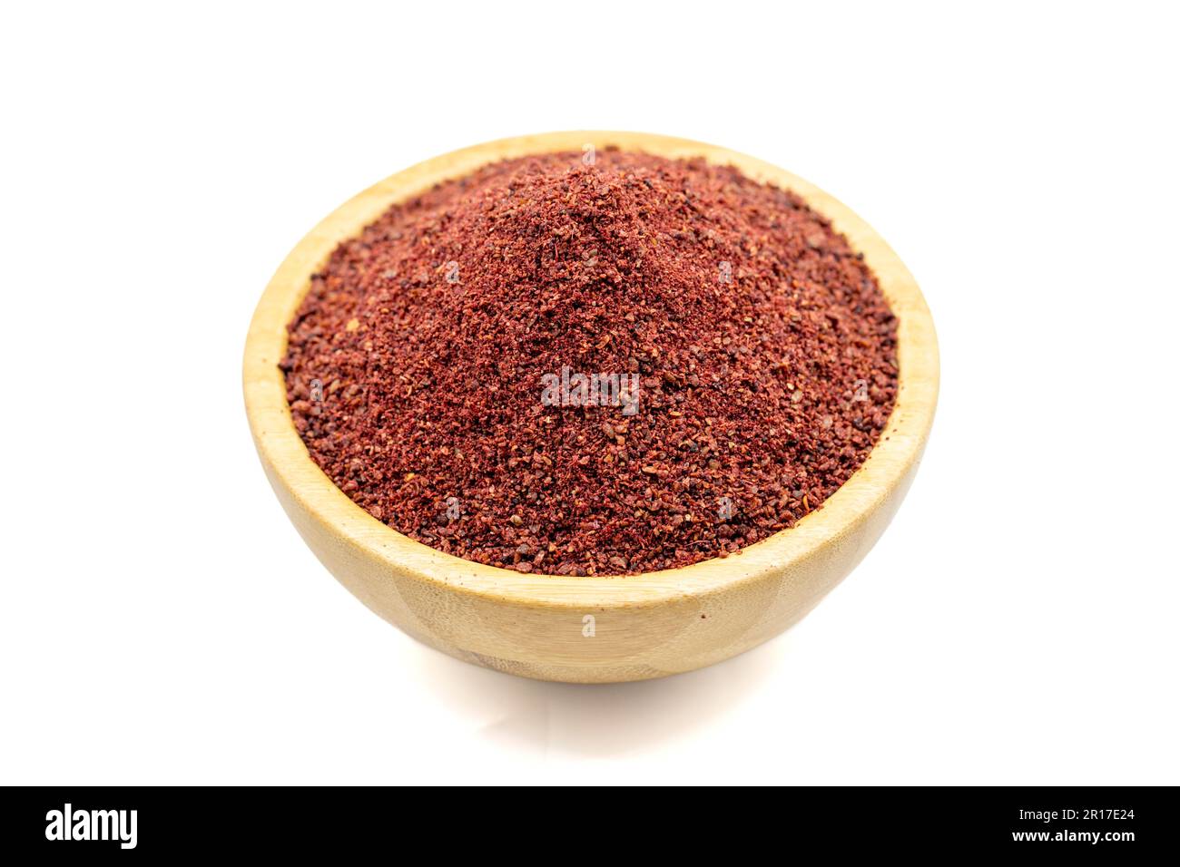 Sumac isolated on white background. Dried ground red Sumac powder