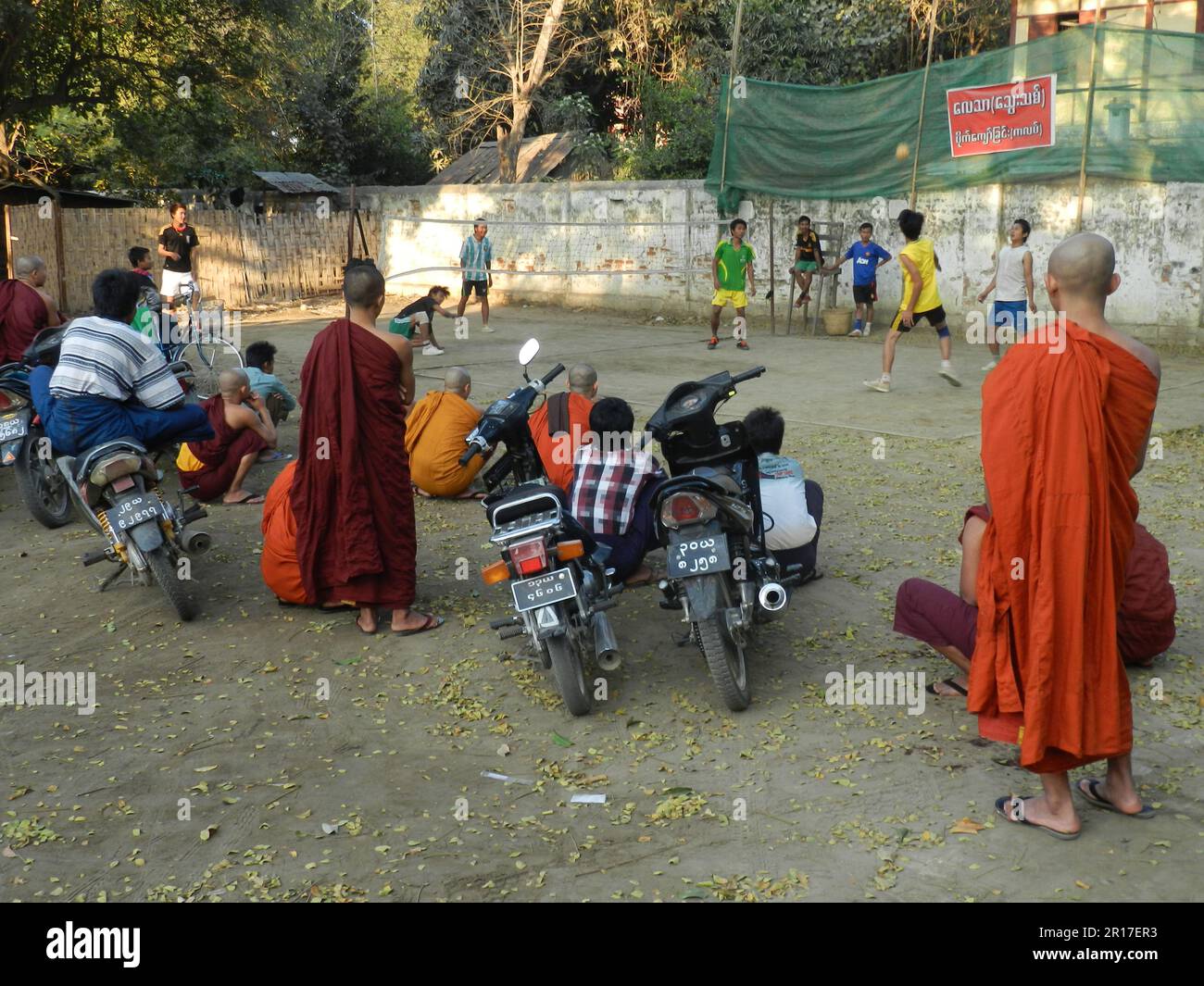 Myanmar, Mandalay spectators of a volleyball match include a number of