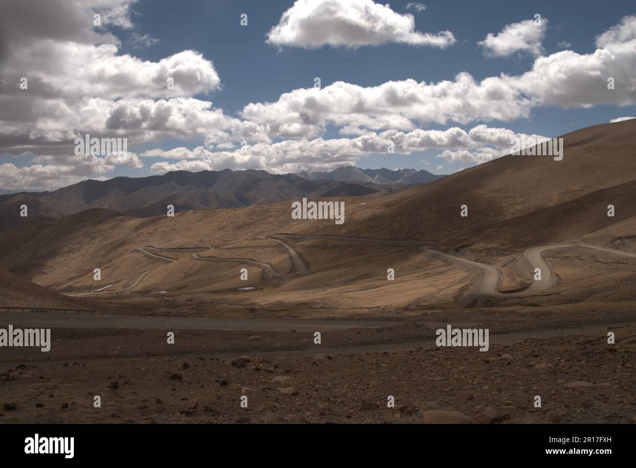 Passum People's Republic of China, Tibet: serpentine road leading down to the ...