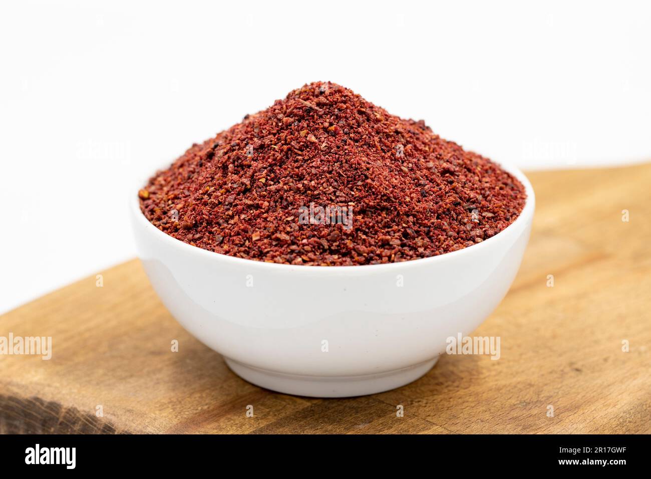 Sumac isolated on white background. Dried ground red Sumac powder ...