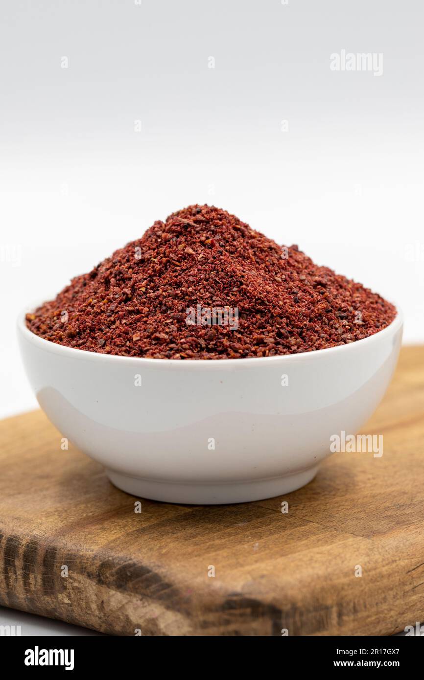 Sumac isolated on white background. Dried ground red Sumac powder ...