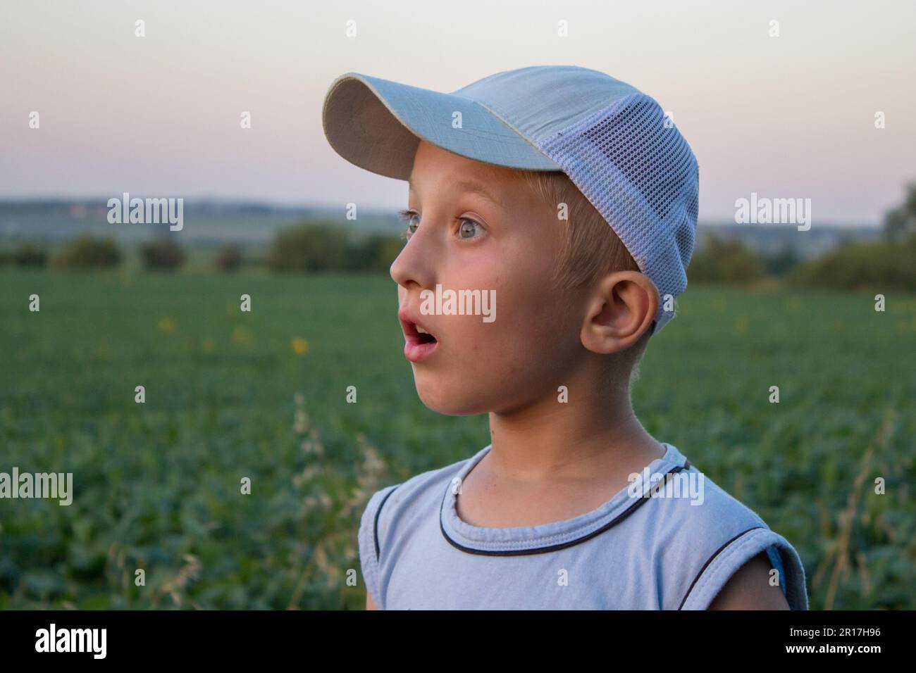 boy is surprised to look at the sunset Stock Photo