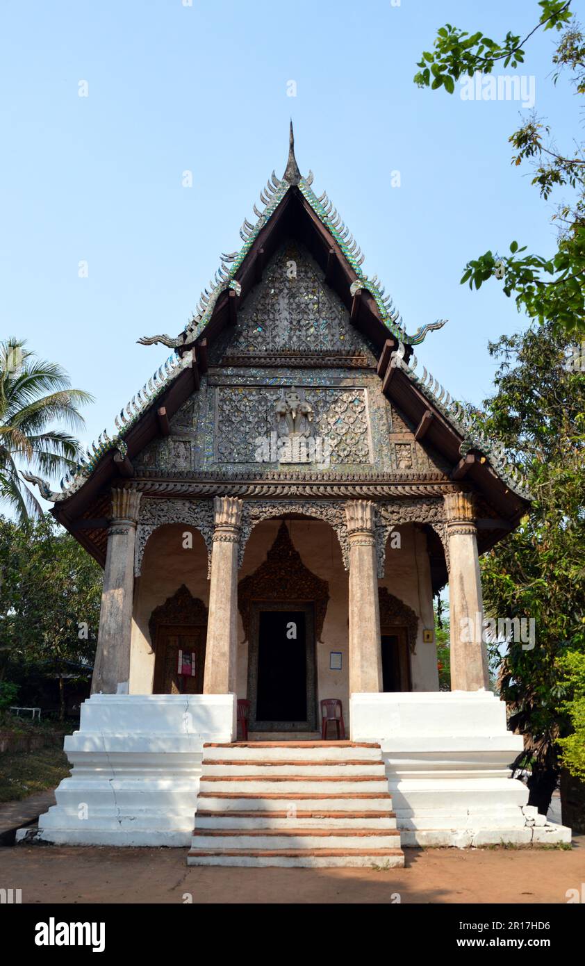 Laos, Luang Prabang Wat Pa Huak with facade showing Buddha riding