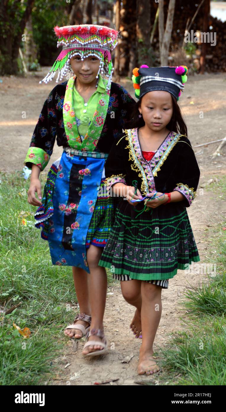 Laos, Luang Prabang:  Hmong children in colourful traditional dress in a hill village near Luang Prabang. Stock Photo