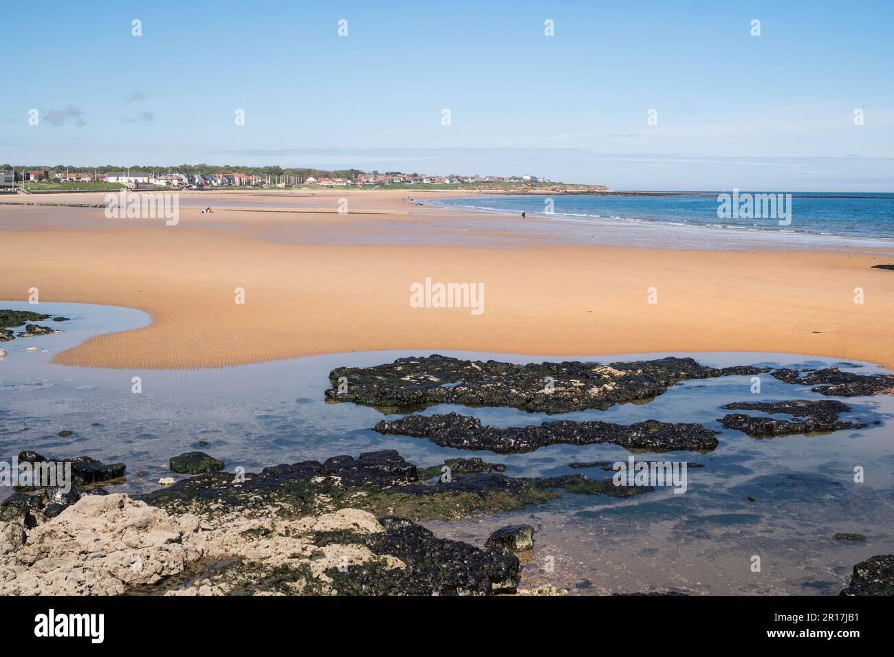 Rockpools and a wide expanse of sandy beach in Seaburn, Sunderland, England, UK Stock Photo