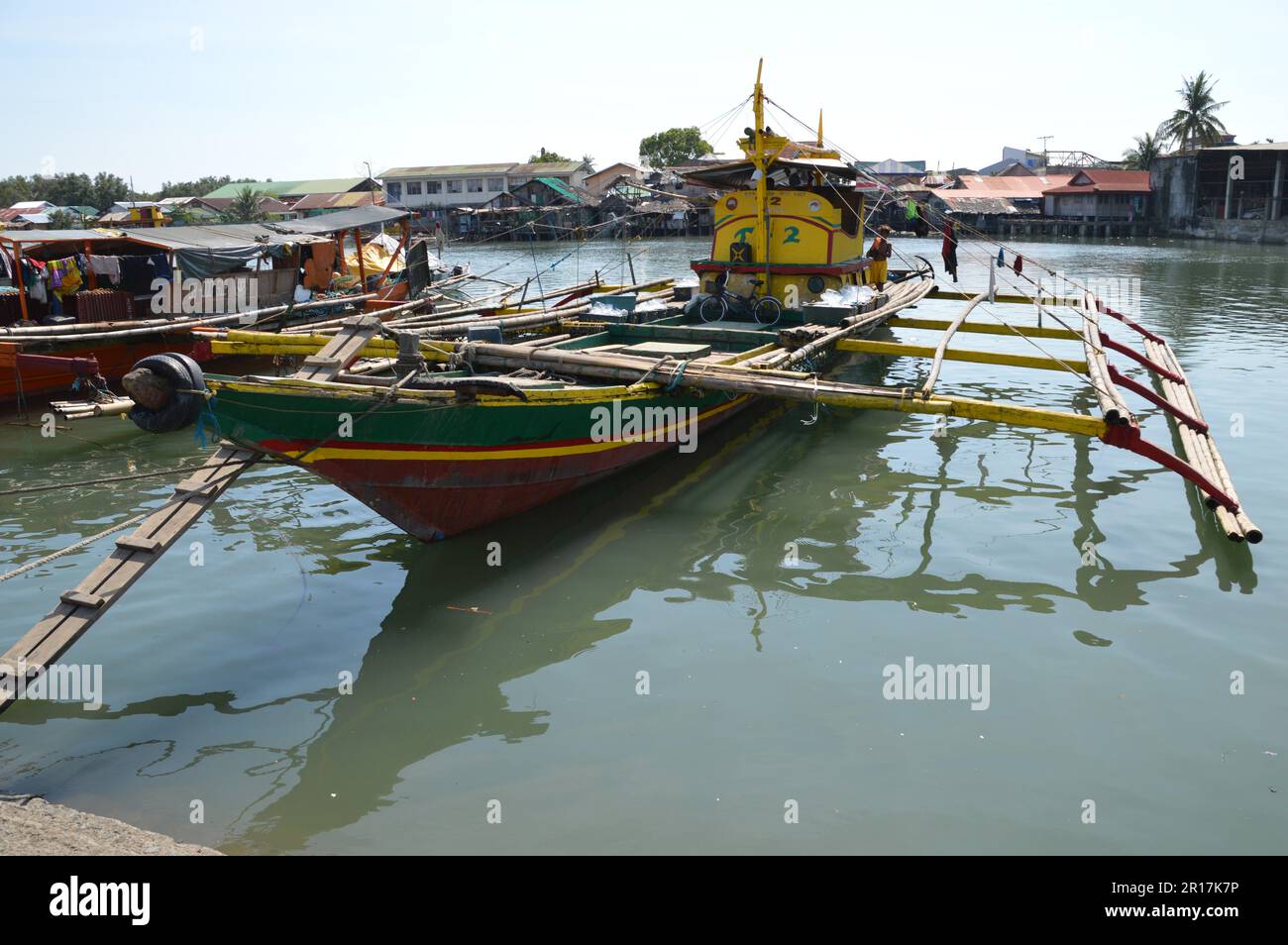 The Philippines, Samar Island, Calbayog: wooden fishing boats with typical  outriggers on the River Calbayog Stock Photo - Alamy