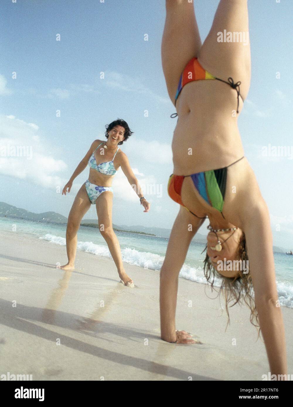 Two women playing on the beach. Stock Photo