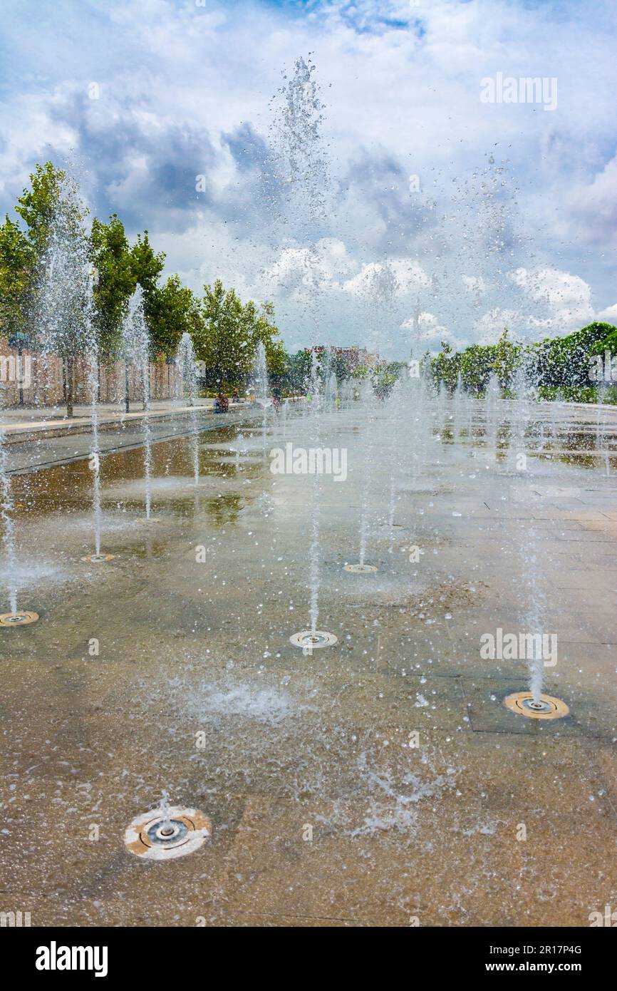 Fountain or jets of water on the ground in a public park. Concepts such as waste of water, drought, water purification Stock Photo