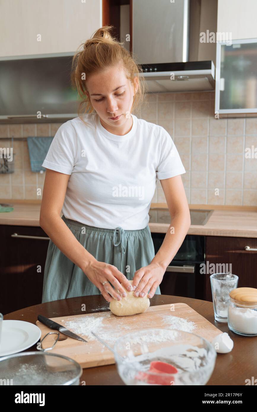 Kneading dough at home. Rustic style photo Stock Photo