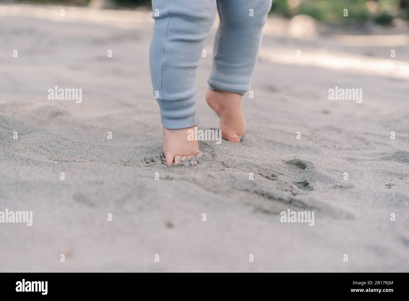 Barefoot baby feet on the sand Stock Photo Alamy