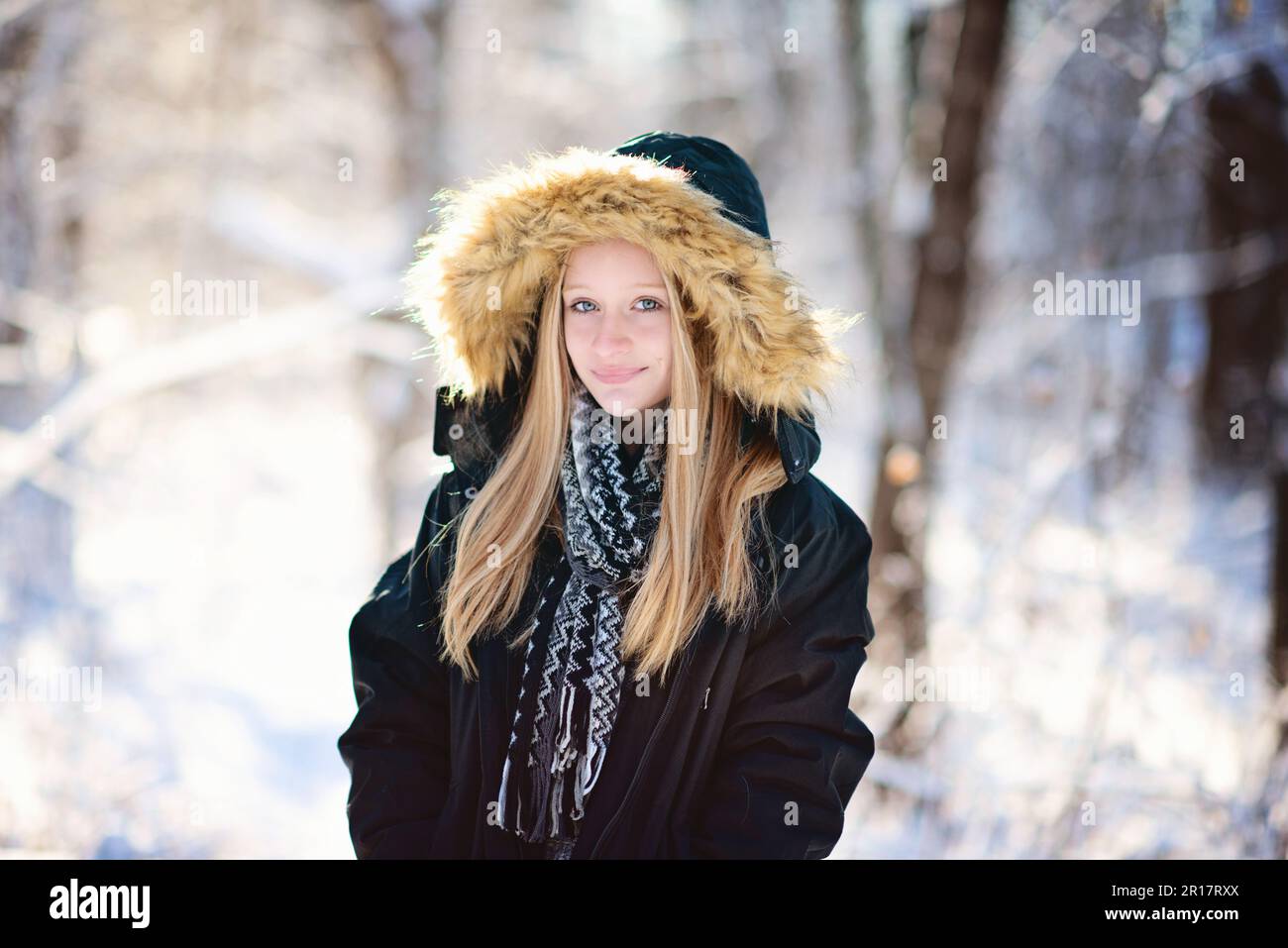 Beautiful teen girl in parka and scarf outdoors in the snow Stock Photo ...