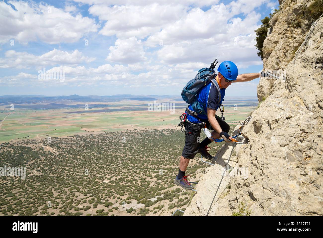 Climbing a ferrata route in Palomera Peak Stock Photo
