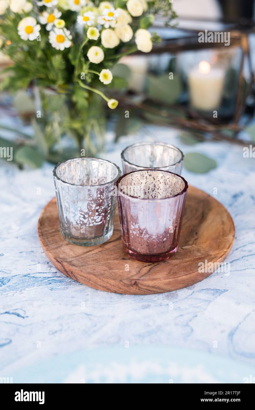 Candle holders at rustic wedding reception Stock Photo