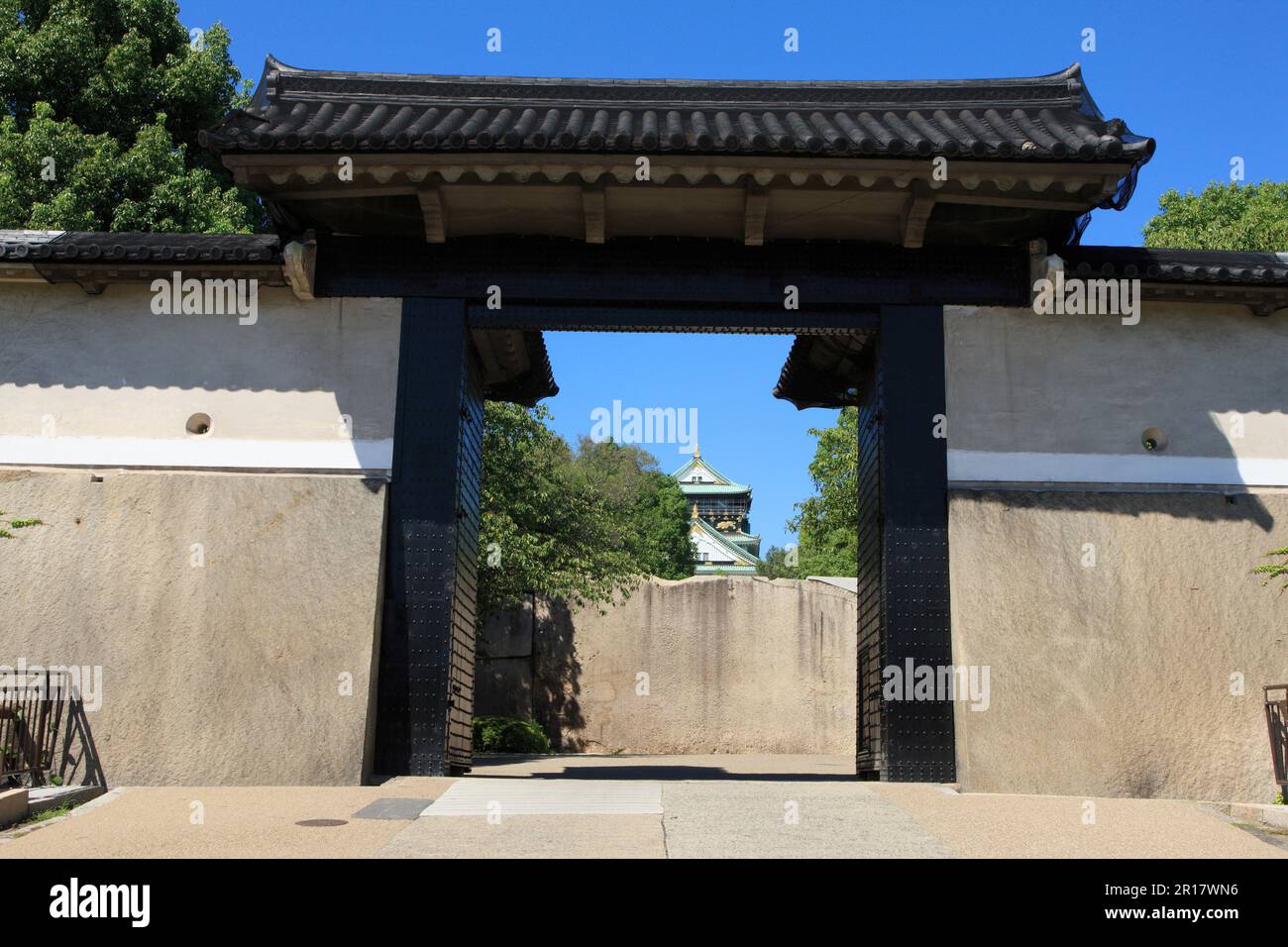Castle tower and Cherry Tree Gate of Osaka Castle Stock Photo