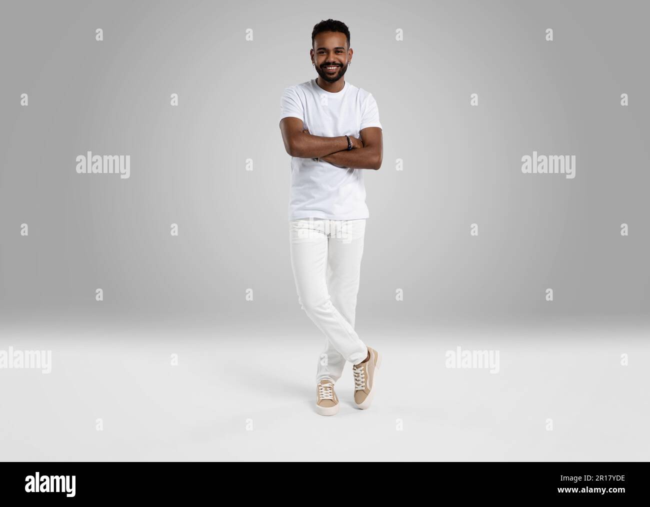 Handsome young african american guy posing in studio - isolated. Stock Photo