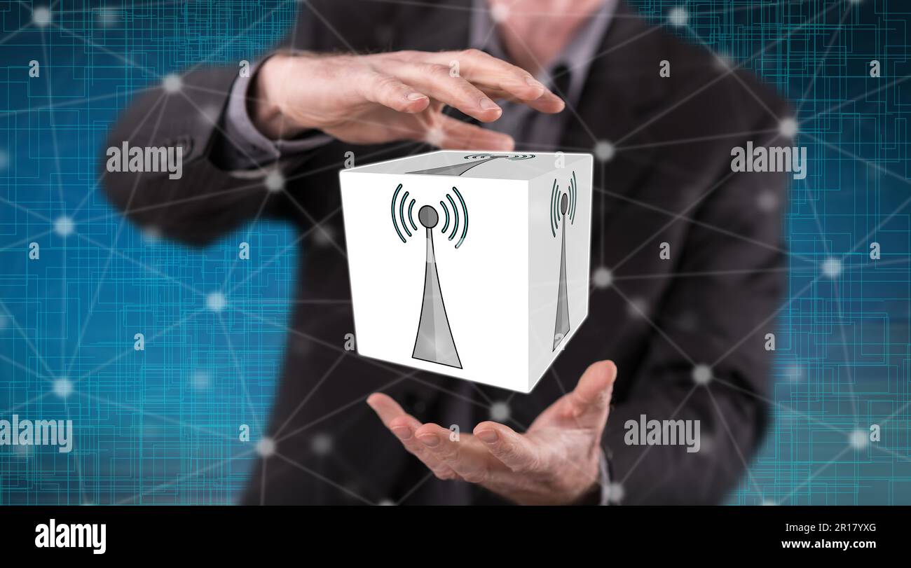 Wifi signal concept between hands of a man in background Stock Photo