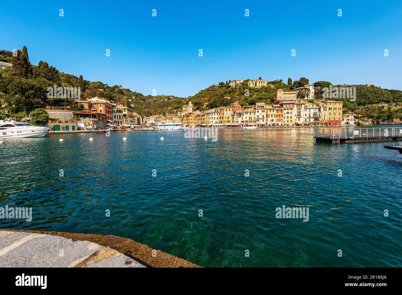 Port of the famous village of Portofino, luxury tourist resort in Genoa province, Liguria, Italy, Europe. Port and colorful houses, Mediterranean sea Stock Photo
