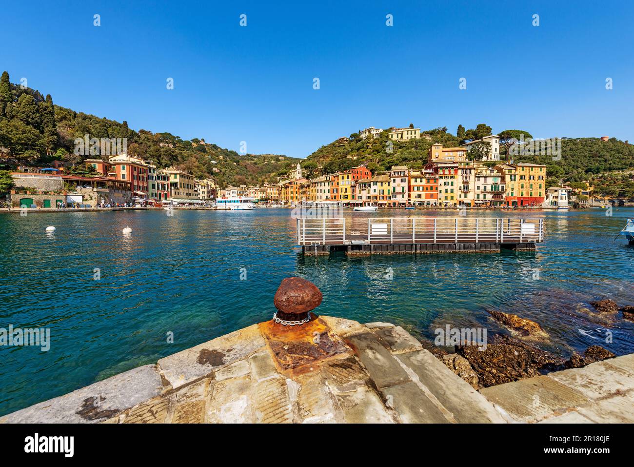 Port and cityscape of Portofino, luxury tourist resort in Genoa Province, Liguria, Italy, Europe. Colorful houses, Mediterranean sea (Ligurian sea). Stock Photo