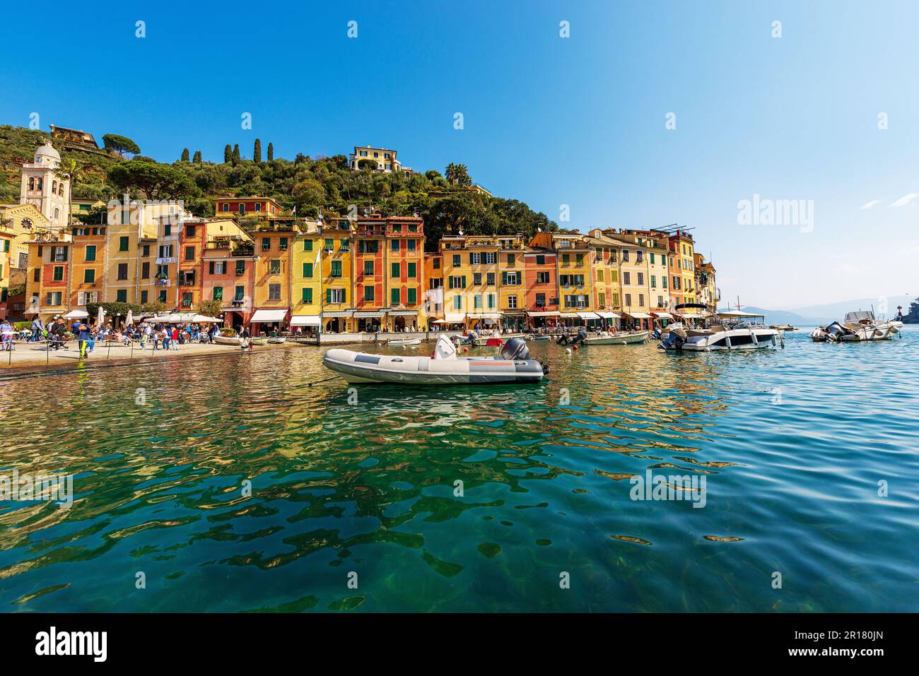 Port of the famous village of Portofino, luxury tourist resort in Genoa Province, Liguria, Italy, Europe. Colorful houses, Mediterranean sea. Stock Photo