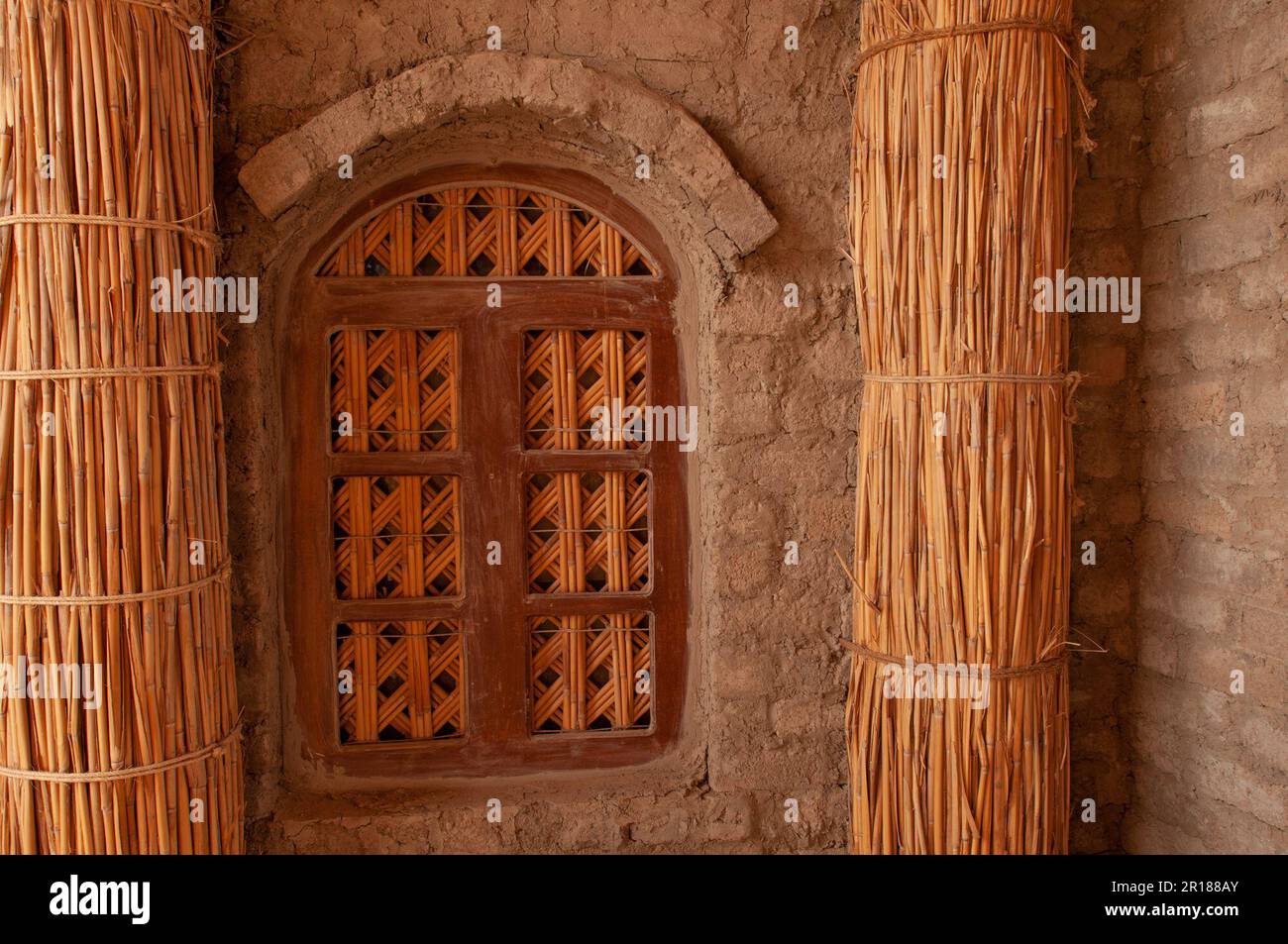 details of window with reed lattice and columns on a building in southern Iraq Stock Photo