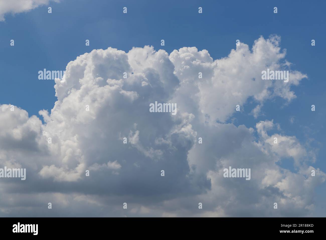 A blue sky filled with fluffy white clouds Stock Photo - Alamy