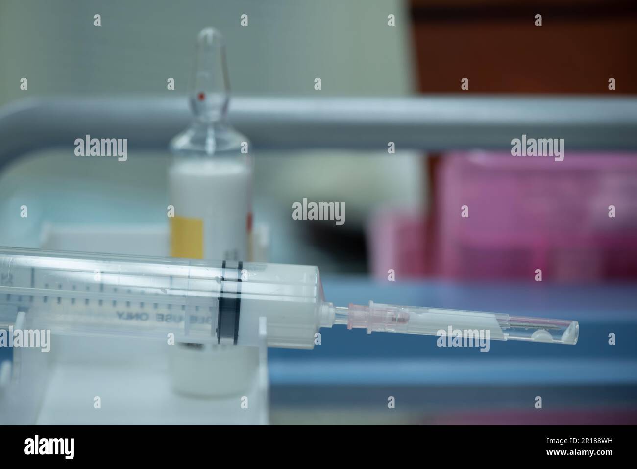 White liquid medication preparing for injection in the syringes and