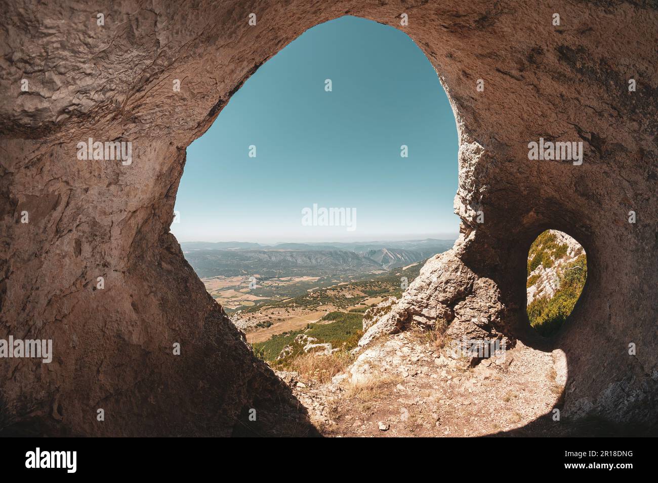 Cave with a view in Serra del Montsec, Ager, Spain.  Landscape in Pyrenees mountains. Stock Photo