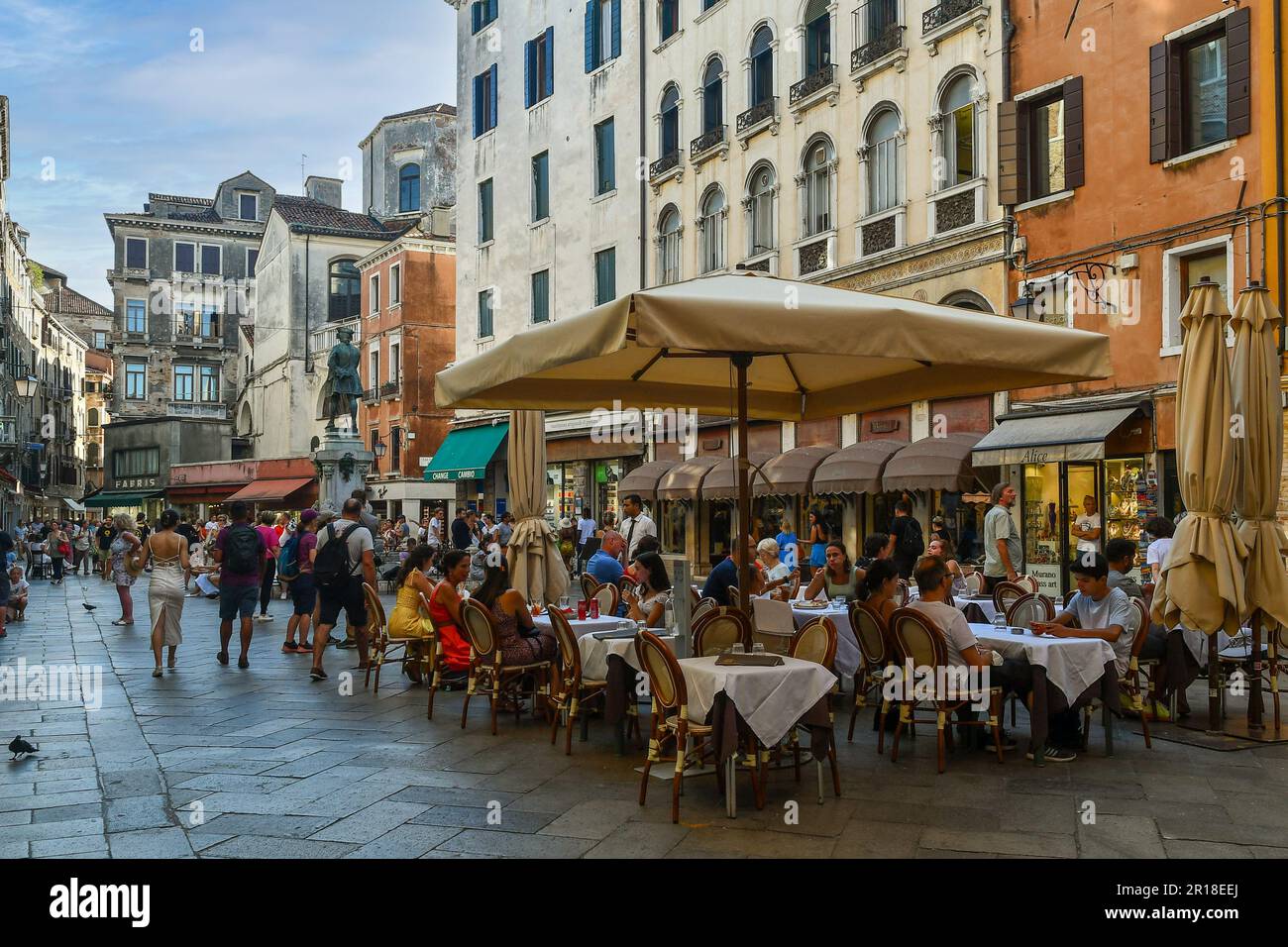 Campo San Bartolomio square with tourists dining in a pavement restaurants in summer, Venice, Veneto, Italy Stock Photo