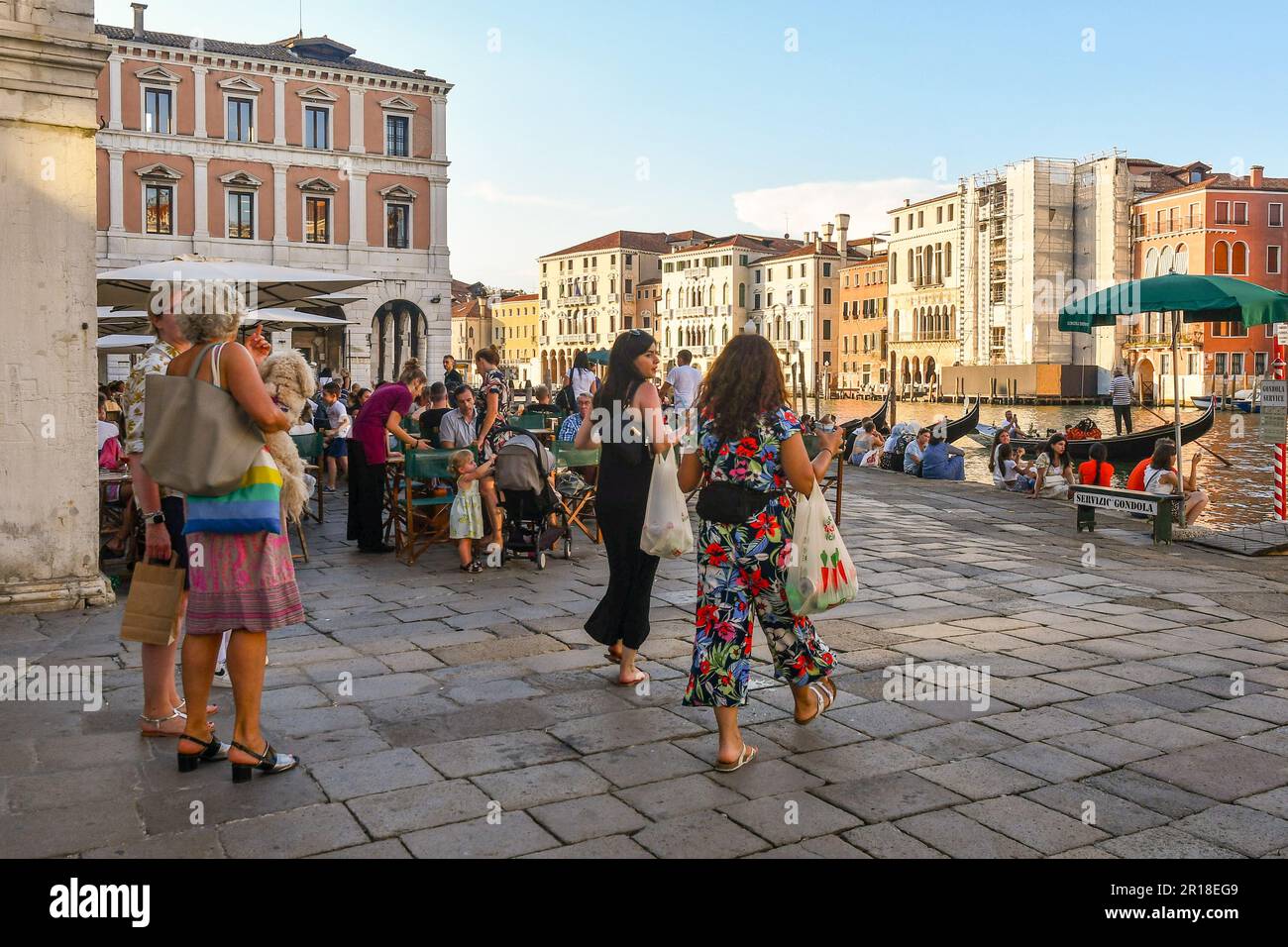 Campo dell'Erbaria square overlooking the Grand Canal during the crowded evening happy hour, Venice, Veneto, Italy Stock Photo