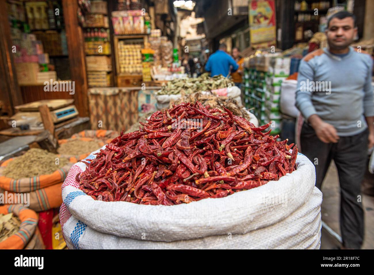 A sack of dried red chili peppers being sold in the spice market close ...