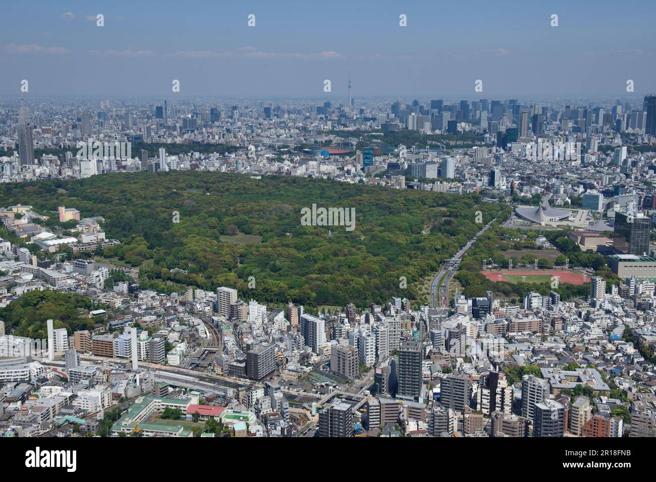 Yoyogi Uehara station aerial shot view from the southwest side towards Yoyogi Park and the sky tree tower Stock Photo