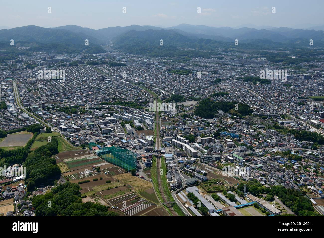 Yamada station aerial shot view from the East side towards mt.takao direction Stock Photo