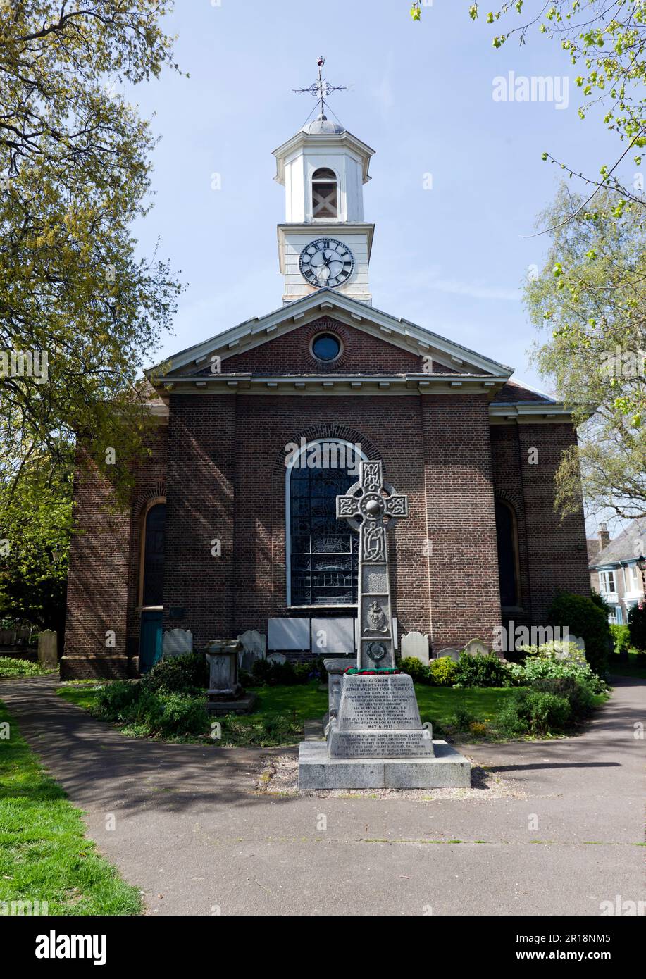 St Church with the Grade II listed Memorial Cross, in front