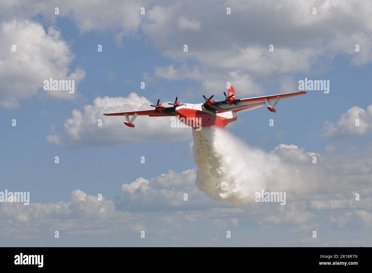 World's largest flying boat dropping water, 77 year old, fights forest fires Stock Photo