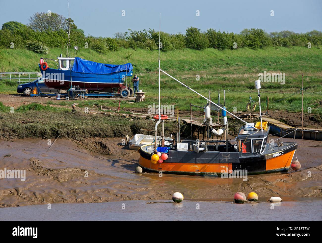 Boats at low tide at Stone Creek, Sunk Island, East Yorkshire, England