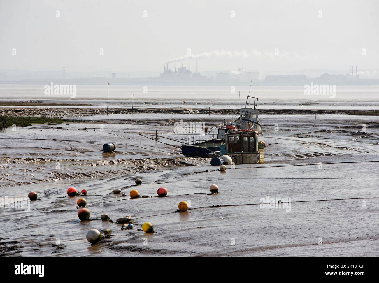 Boats at low tide at Stone Creek, Sunk Island, East Yorkshire, England