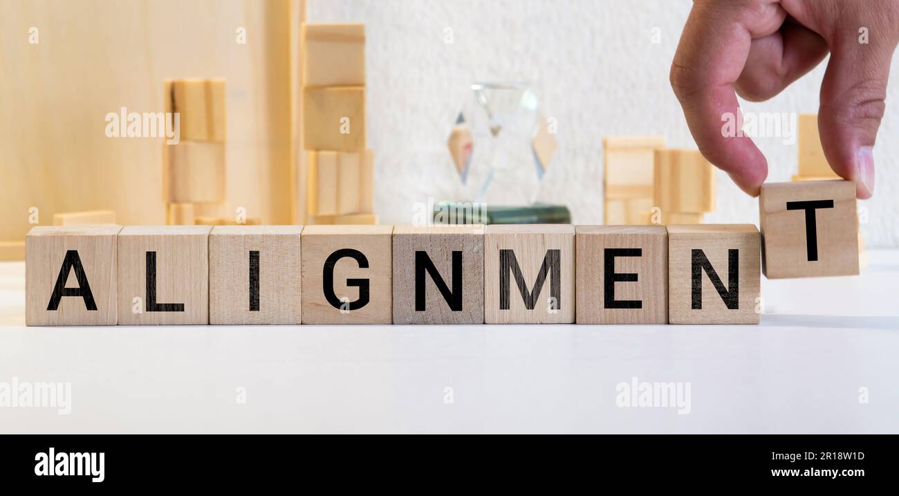 Alignment. Cubes form the word Alignment. Broad concept from business ...