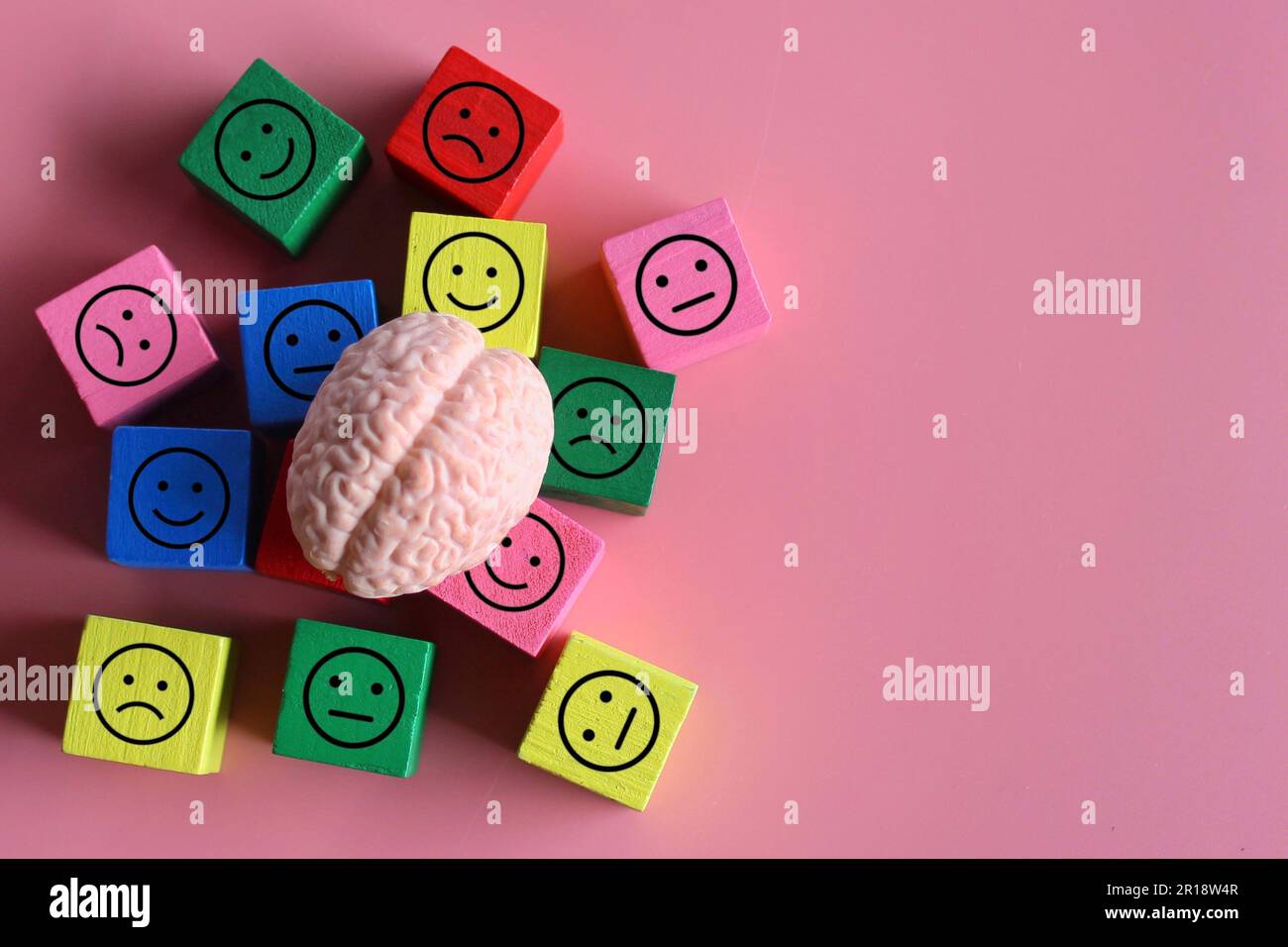 Human brain with happy, neutral and sad icon. Mental health, mood swings, bipolar disorder concept. Stock Photo