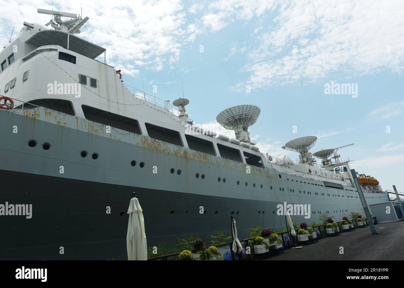 SHANGHAI, CHINA - MAY 10, 2023 - The Yuanwang-1 survey ship is seen in Dock 2 at the original site of Shanghai Jiangnan Shipyard in Shanghai, China, May 10, 2023. Yuanwang-1 is the first generation integrated space oceangoing survey ship designed and built by China. Yuanwang-1 made 44 ocean expeditions in 32 years from 1978 to 2010, safely sailed for more than 2,600 days and 440,000 nautical miles, and successfully completed 57 major national scientific research and test missions, including intercontinental missiles, submarine-launched missiles, various domestic and foreign satellites and mann Stock Photo