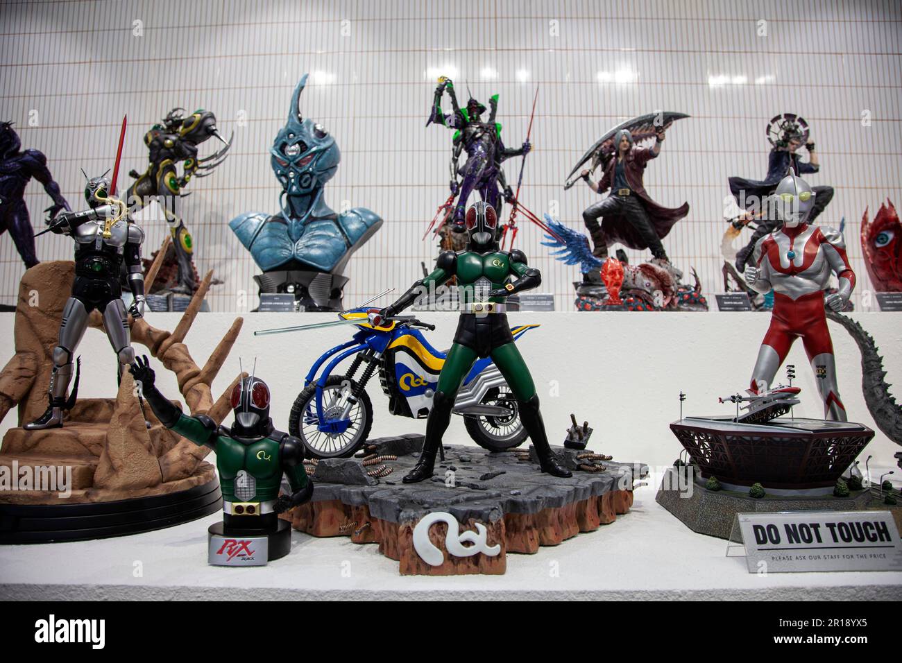 The superhero statues are seen displayed on the opening day of the