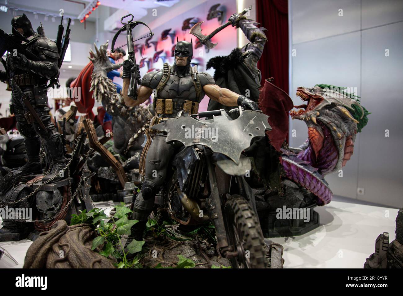 The superhero statues are seen displayed on the opening day of the