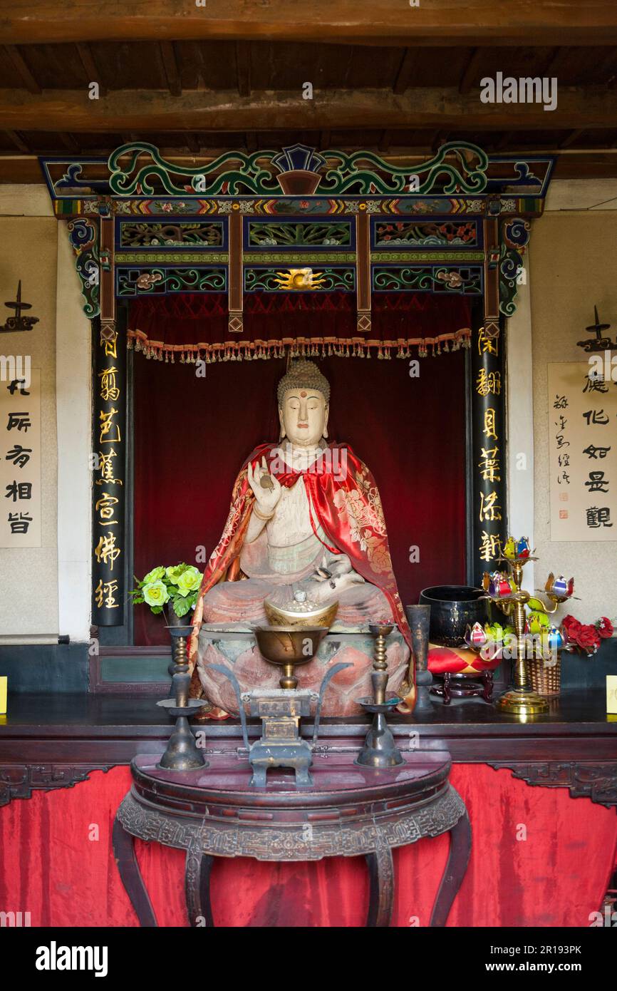 Buddhist shrine with Buddha statue at the Hui Wu Lin museum (according