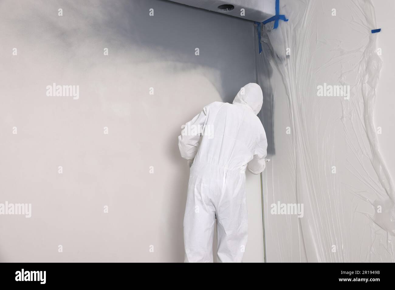 Rear View of Painter Man Looking at Blank Wall, with Paint Stick Stock  Image - Image of improvement, professional: 92914367