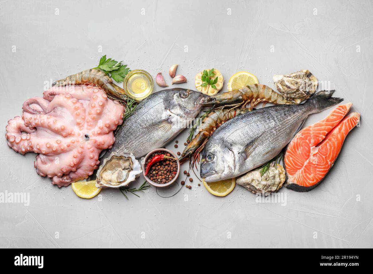 Flat lay composition with fresh raw dorado fish and different seafood ...